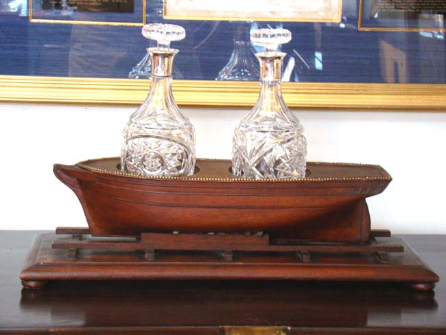 A Wonderful 19th century mahogany Decanter Stand in the form of a ship on a shipyard launching ramp circa 1850-1870.